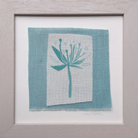 Turquoise flower with seeds ~ hand stitched linen collage