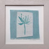 Turquoise flower with seeds ~ hand stitched linen collage